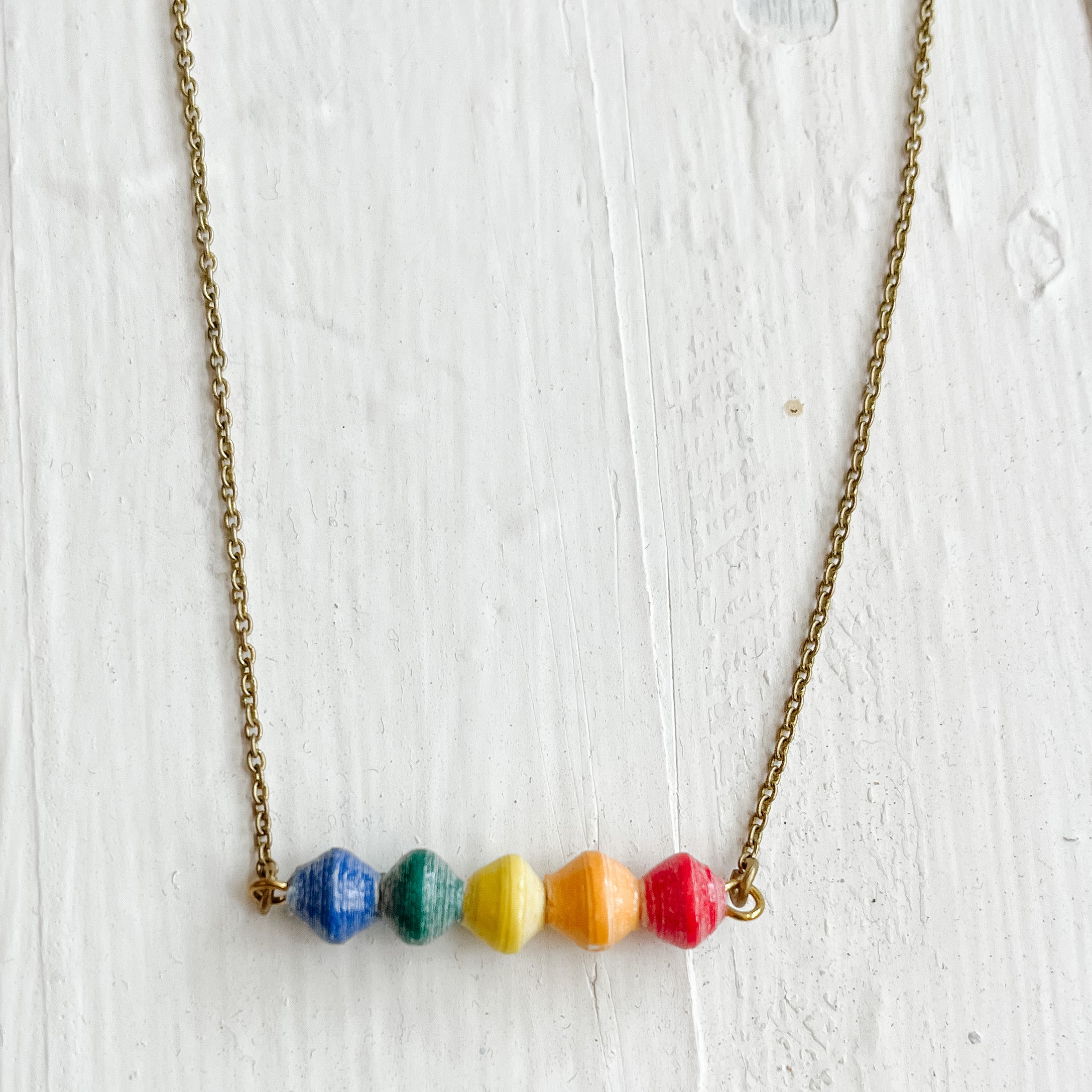 JustOne's thin necklace with five beads to make a rainbow handmade in Uganda