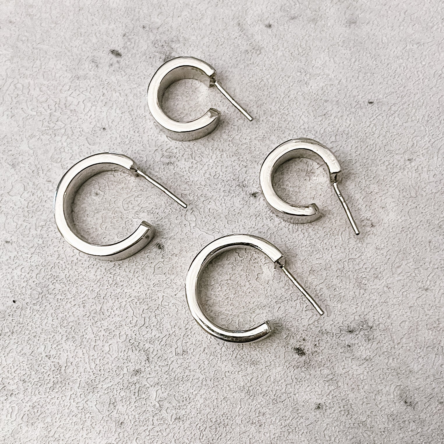 JustOne's silver small hoops that hug your ear, handcrafted in Kenya