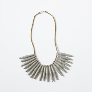 JustOne's necklace with long grey paper beads dangling off, handcrafted in Uganda