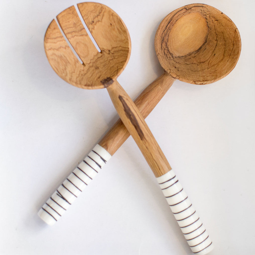 JustOne's handcrafted wooden salad spoons with striped handles made from ethically sourced bone, handcrafted in Kenya