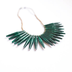 JustOne's necklace with long green paper beads dangling off, handcrafted in Uganda
