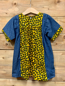 JustOne's small blue dress with design around the collar and cuffs of the sleeves, hand-sewn in Uganda