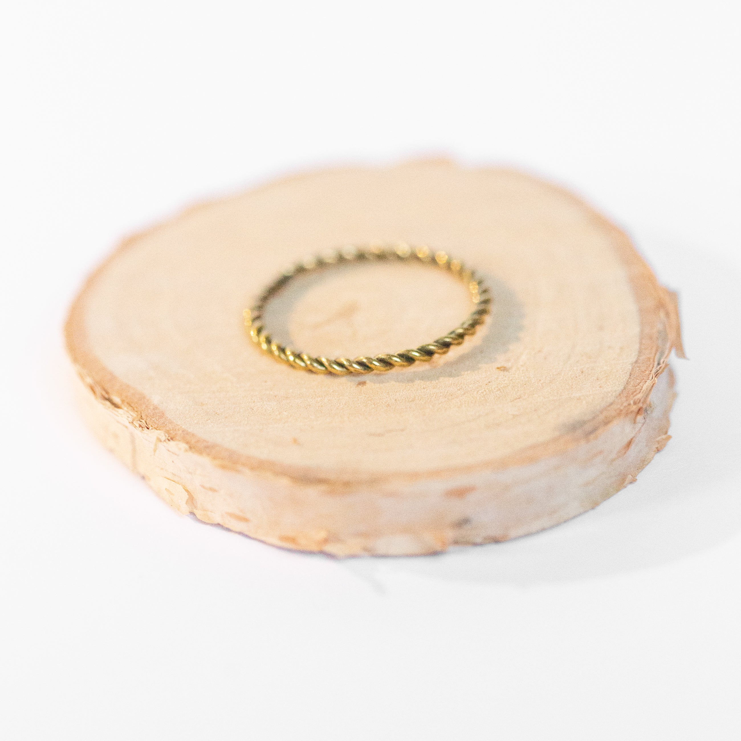 JustOne's brass ring with twisted design, handcrafted in Kenya