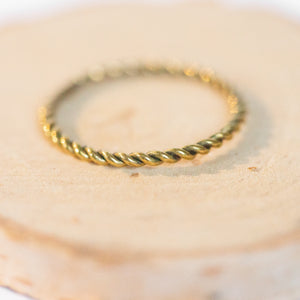 JustOne's brass ring with twisted design, handcrafted in Kenya