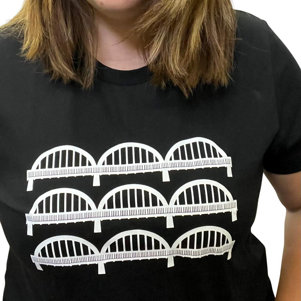 JustOne's black t-shirt with the caledonia bridge in white. The bridge is shown in three rows making a total of nine arches