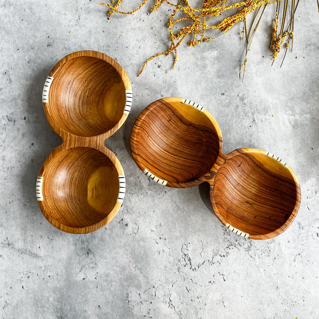 JustOne's wooden double bowl that looks like two circular bowls fused together, handmade in Kenya