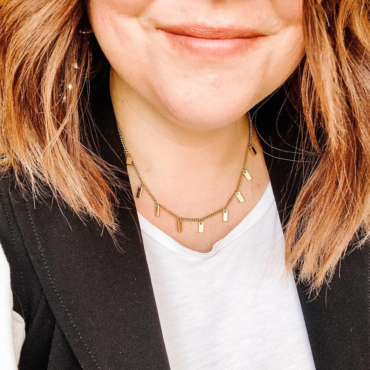 JustOne's brass necklace with small rectangle bars attached, handcrafted in Kenya