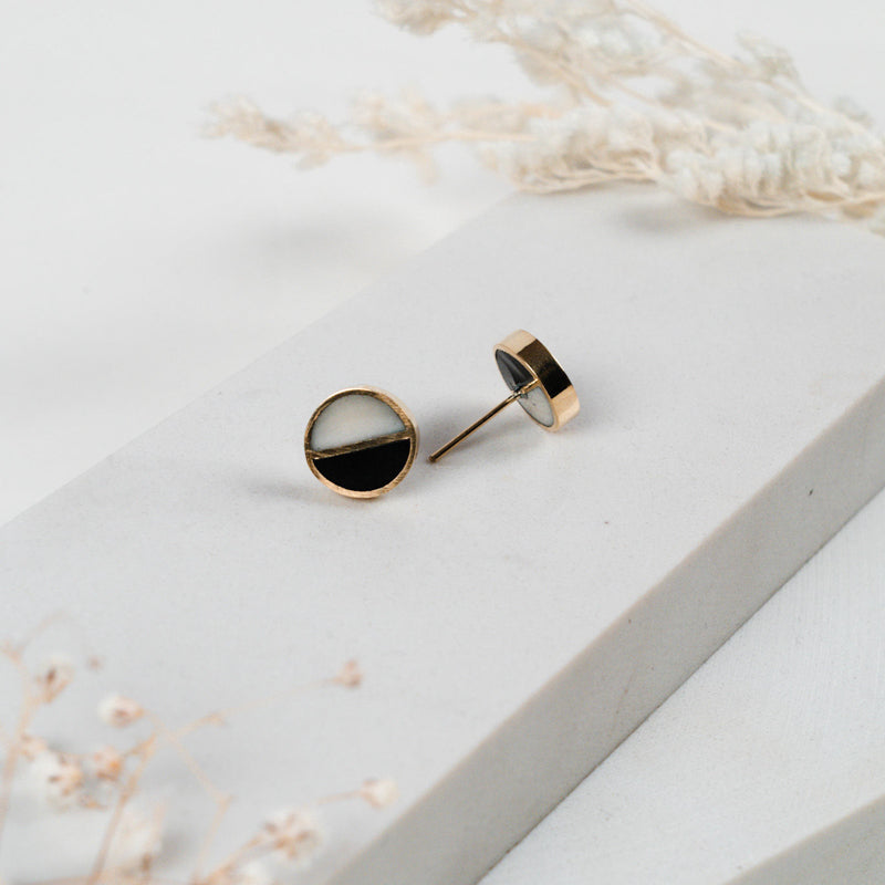 JustOne's black and White circle studs with a brass outline ethically made from recycled materials in Kenya