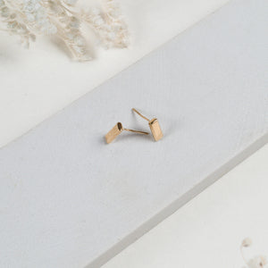 JustOne's small, brass, bar studs made ethically from recycled materials in Kenya